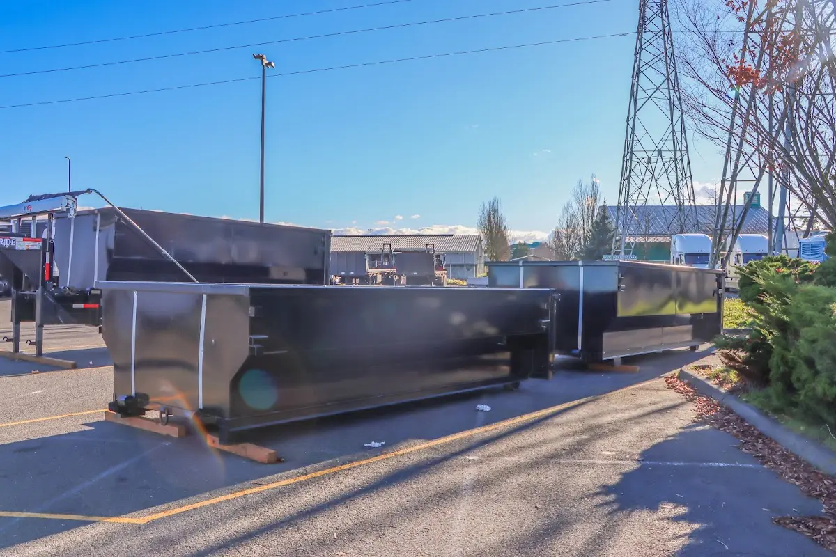 Roll-off dumpster ready for waste disposal at job site for Construction Dumpster Rental in Bedford